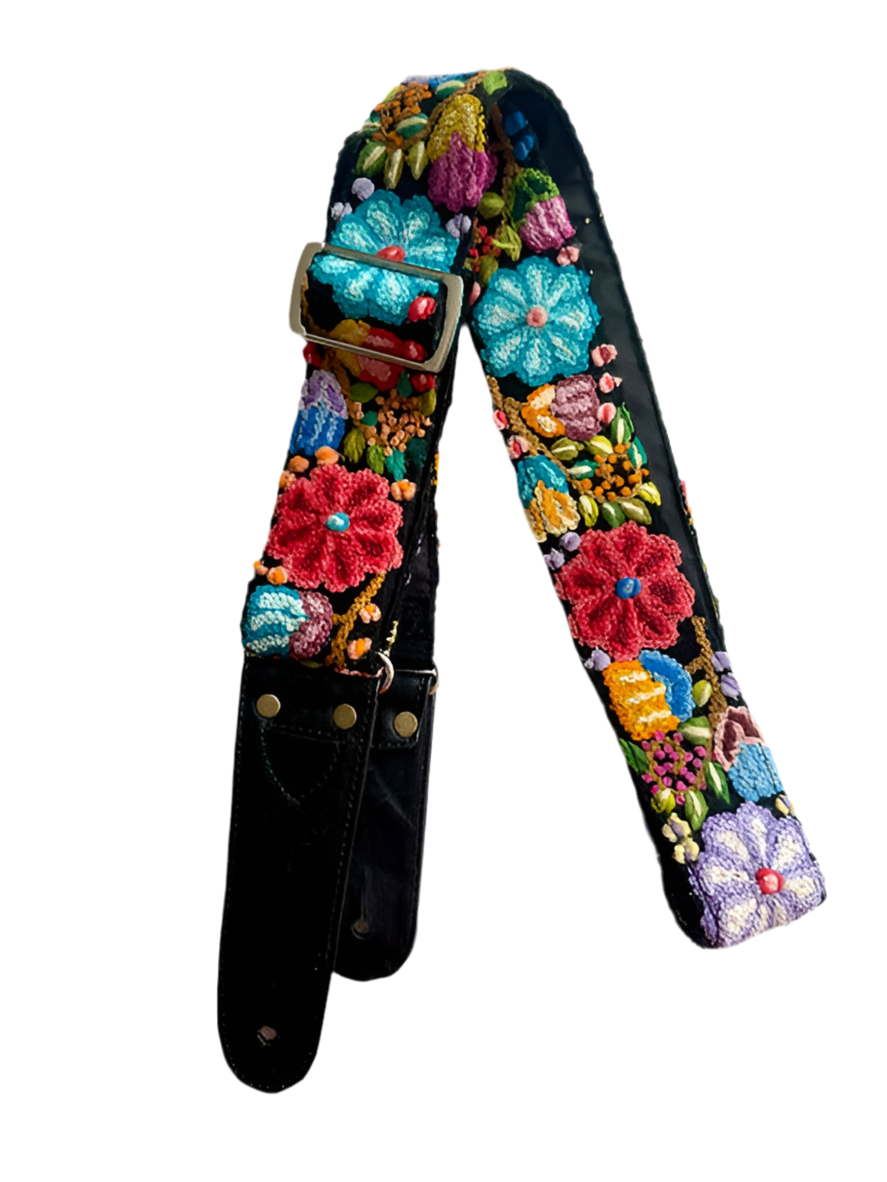 Black Floral Guitar Strap featuring hand-woven embroidery, colorful flowers, adjustable length, leather ends, and a pick pocket, designed for comfort and style.