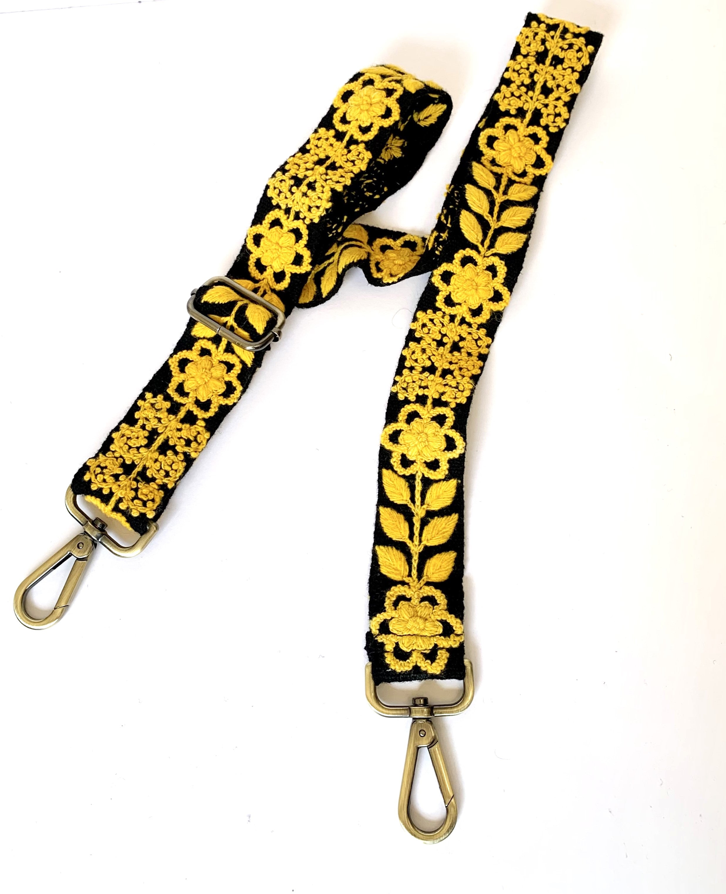 Black and yellow strap with metal hooks