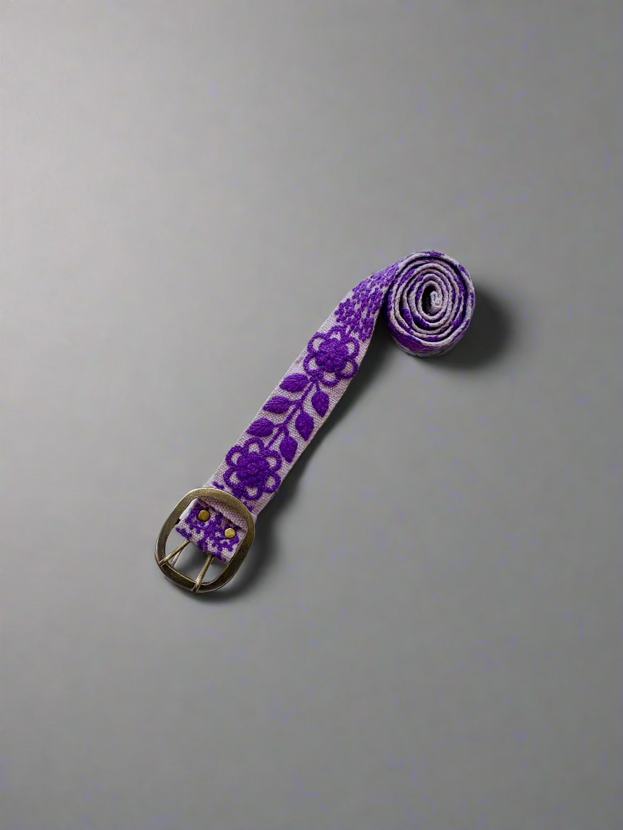 Eliza Embroidered Belt: A hand-loomed wool belt with a purple floral and leaf design