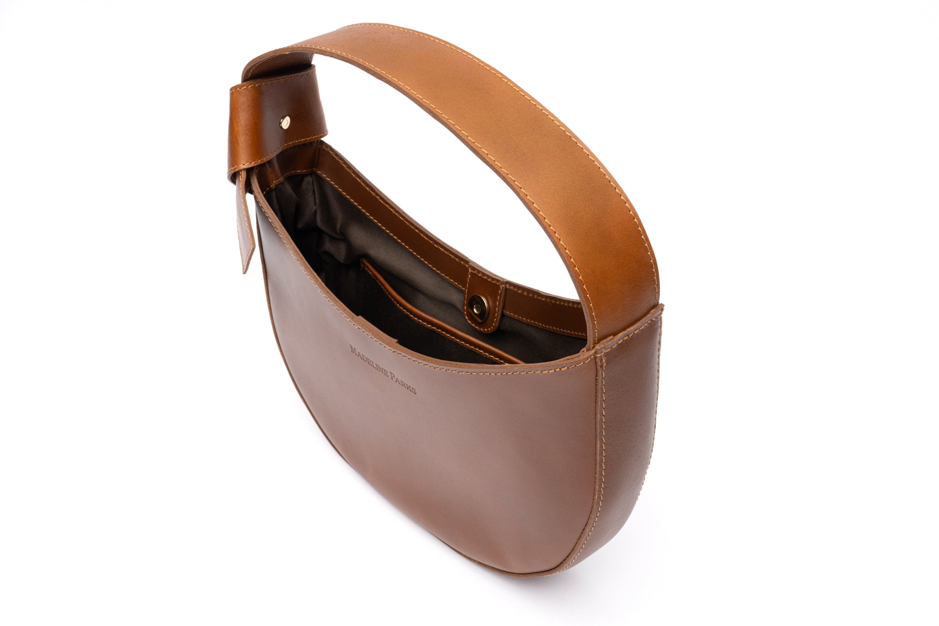 Angle view Stylish fashionable crescent shaped leather purse with leather handle