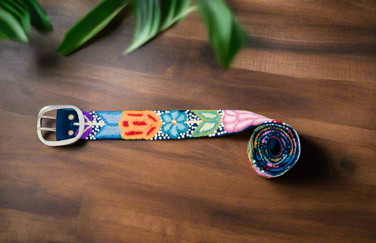 Navy Floral Embroidered Belt displayed on blue background.