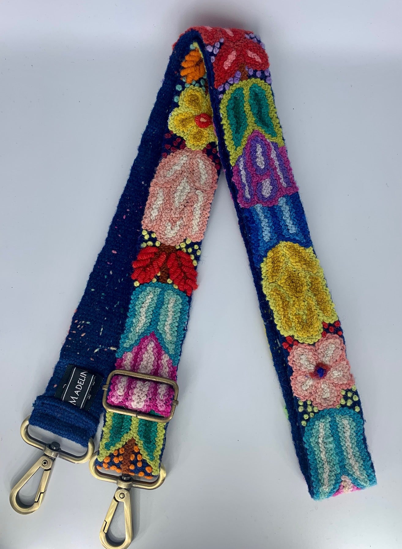 Navy Floral Adjustable Strap with hand-embroidered multicolor flowers.