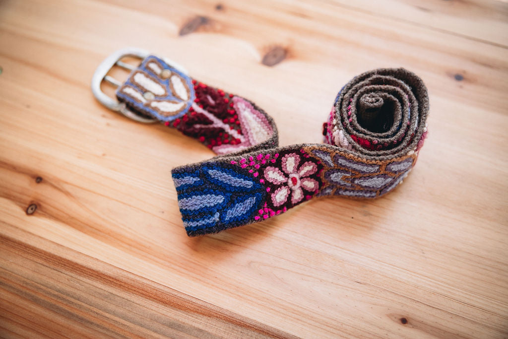Brown hand loomed wool embroidered belt with floral design. Handmade by fair trade artisans in the Andes Mountains of Peru.