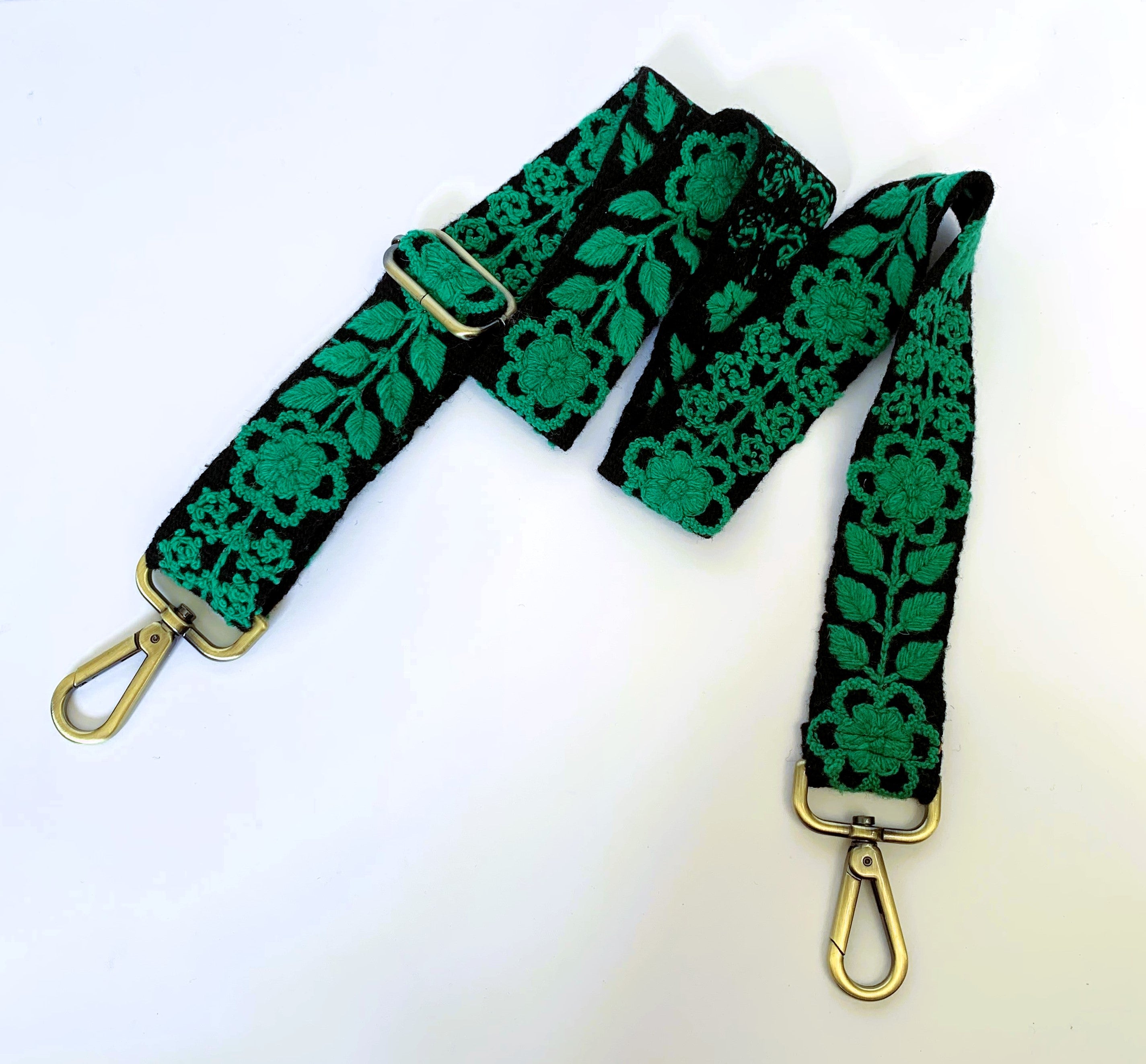 Black and green adjustable purse strap with gold clasps