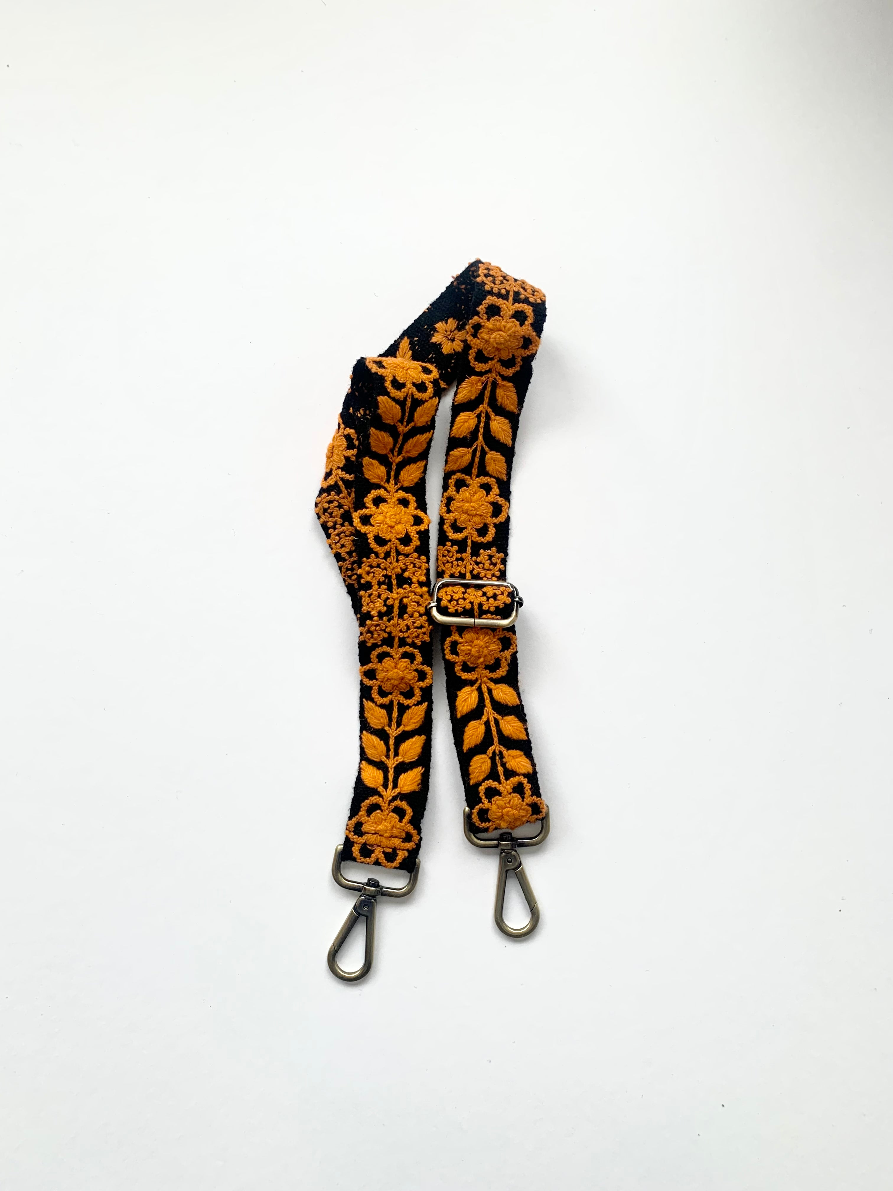 Black and orange strap with metal hooks