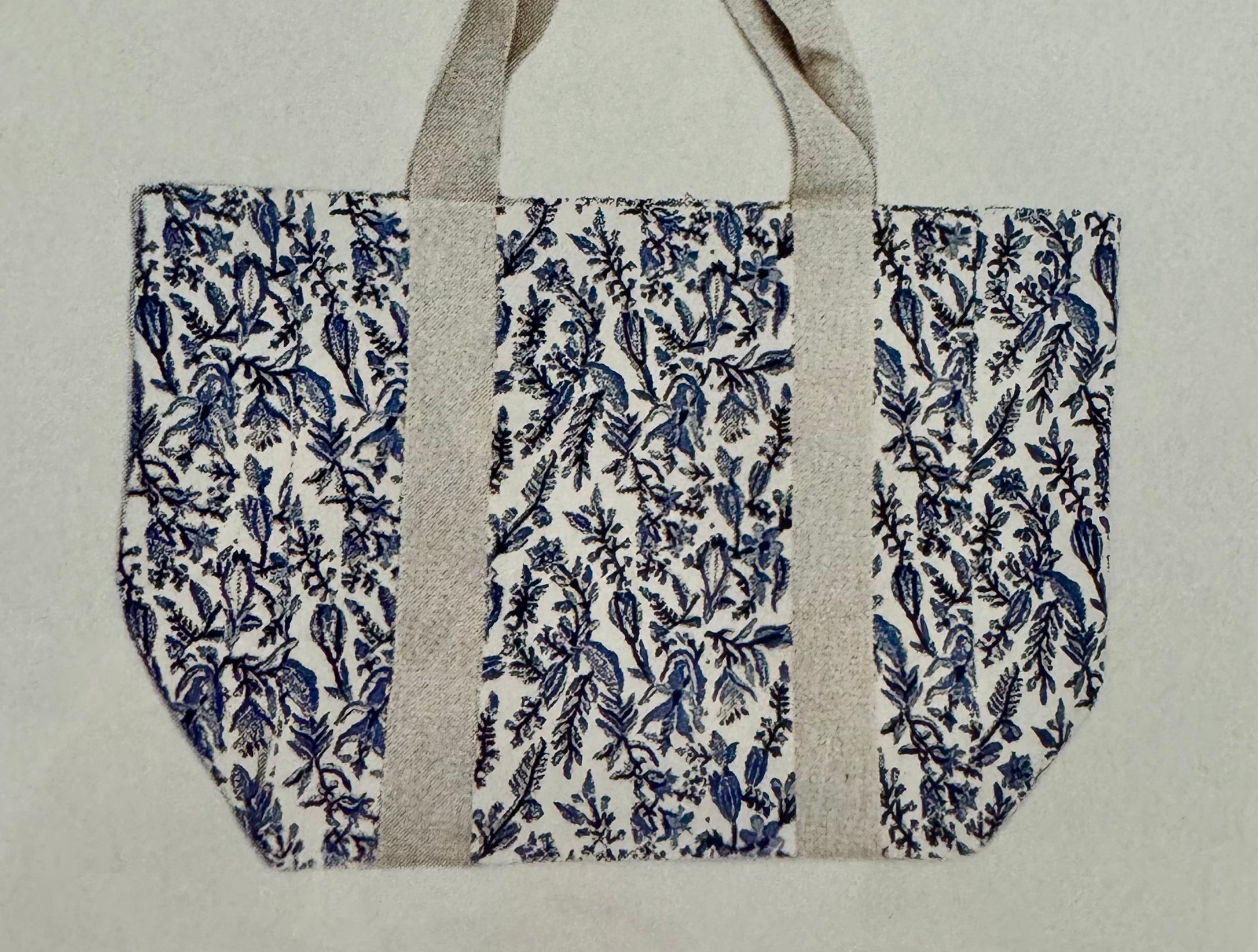 Block Printed Canvas Bag with floral design, featuring a gray strap. Hand printed on 100% cotton, measuring 18 x 15 x 7.