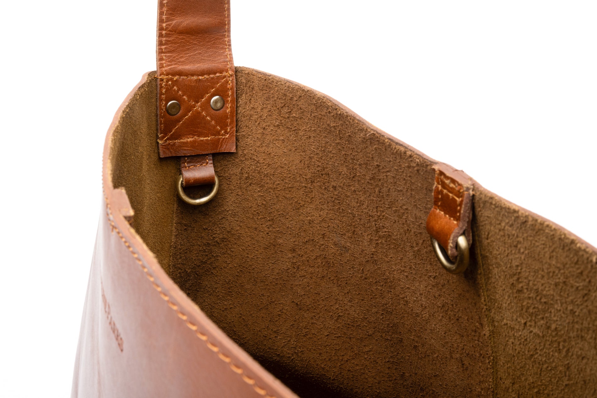 Close up view of Artisan brown leather bucket bag ]