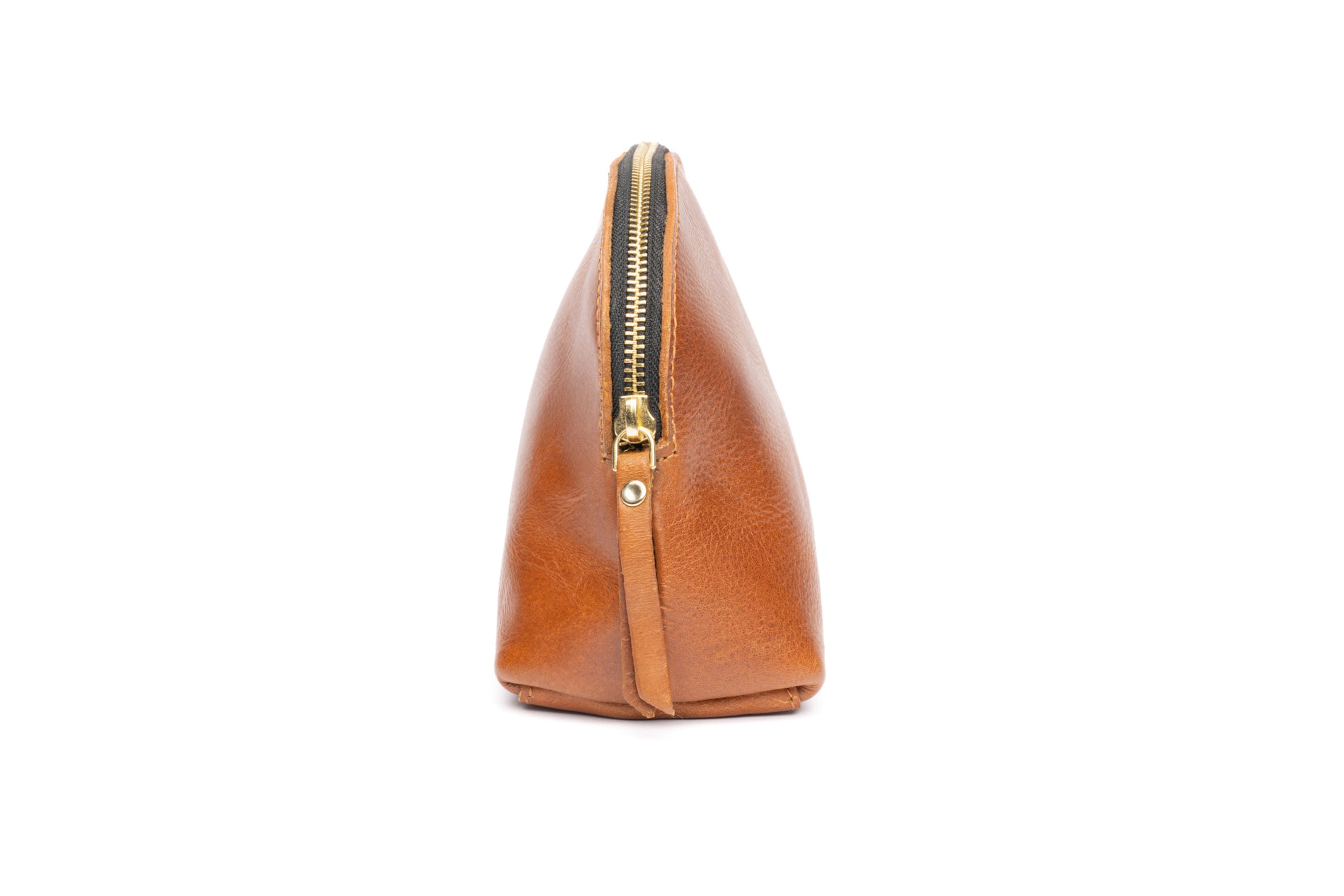 Side view of Stylish fashionable brown leather makeup bag that is fair trade