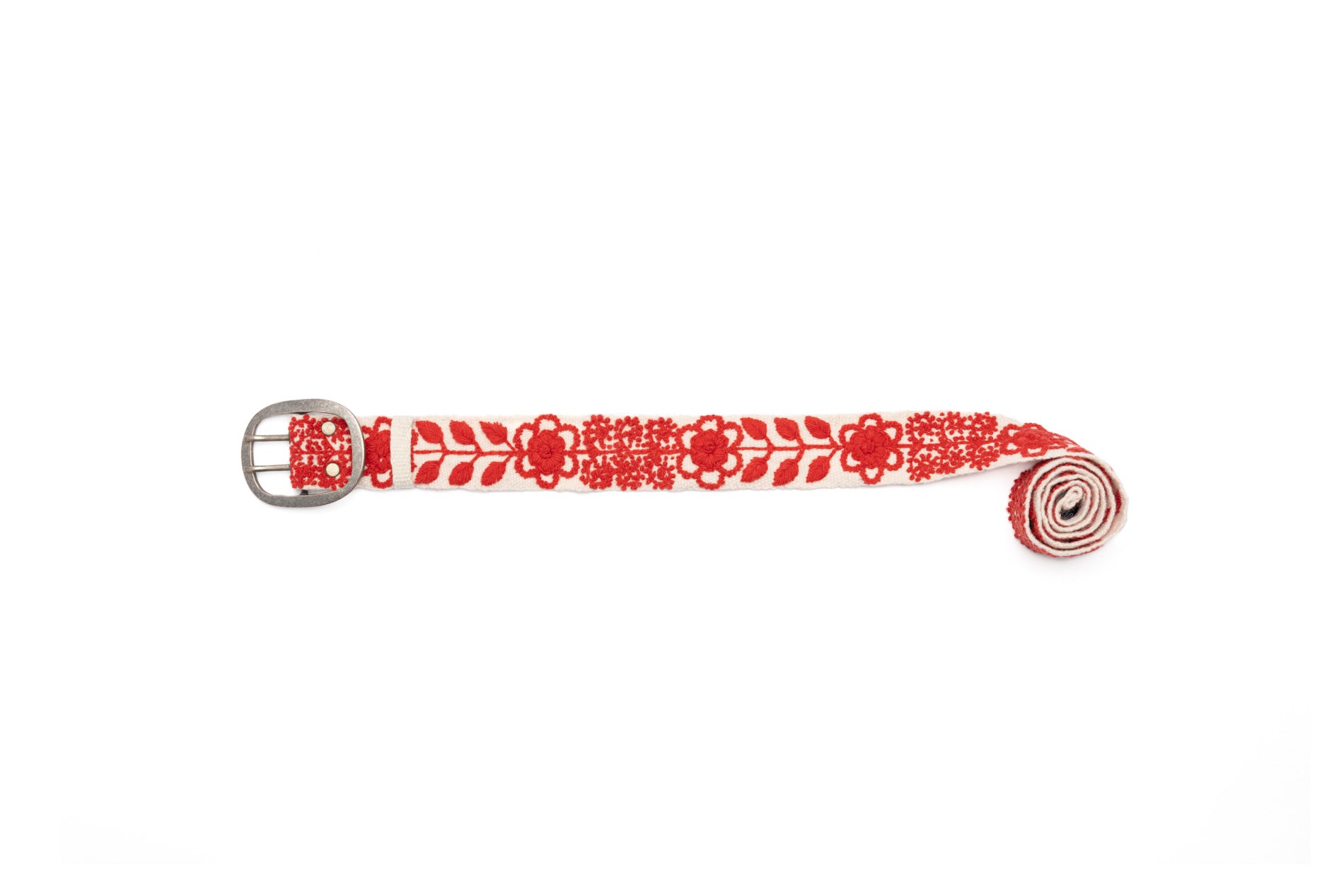 Hand-loomed cream wool Abbey Belt with red embroidered leaves and flowers. Handcrafted by fair trade artisans in the Andes Mountains, Peru. Sizes: Small, Medium, Large, Extra Large.