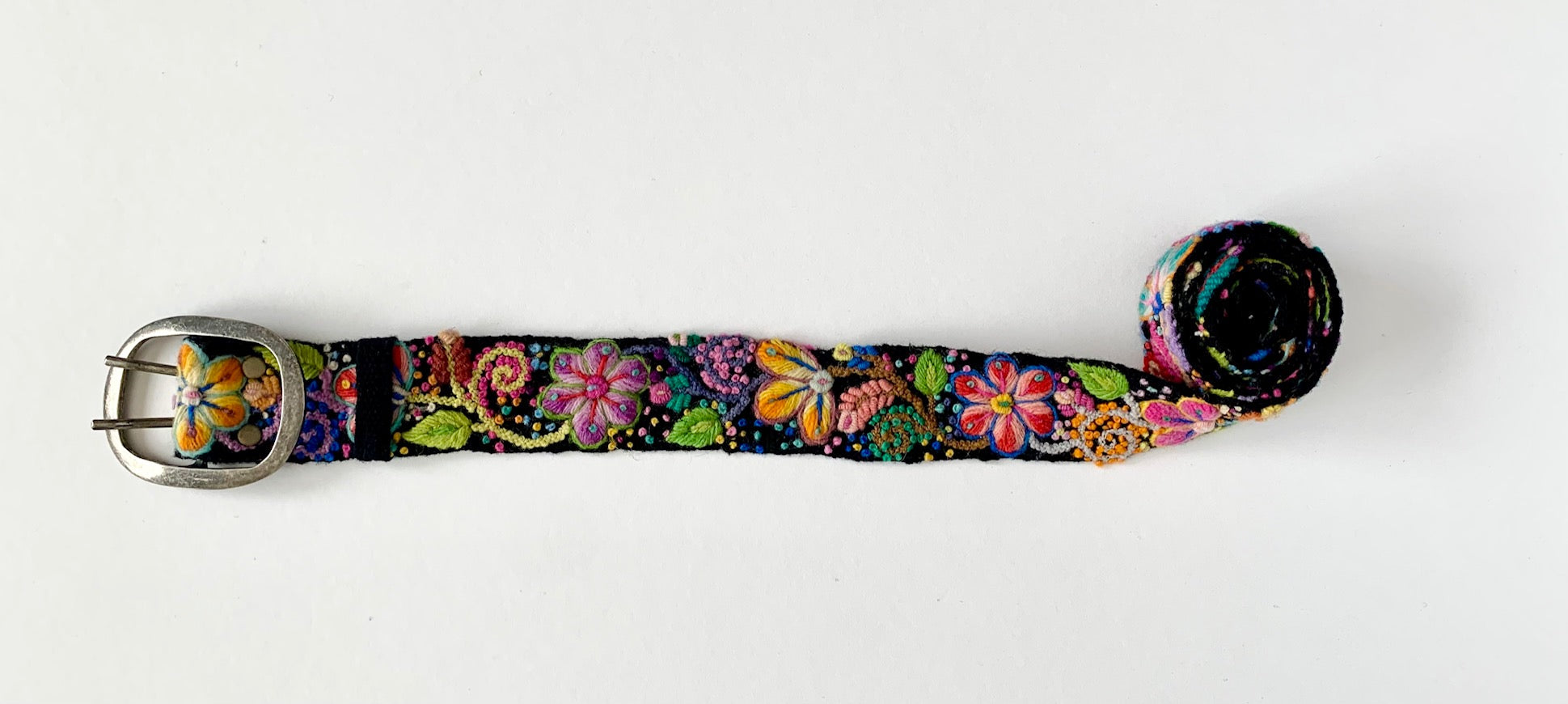 Black Floral Belt with colorful fabric flowers and leaves, hand loomed and embroidered by fair trade artisans in Peru.