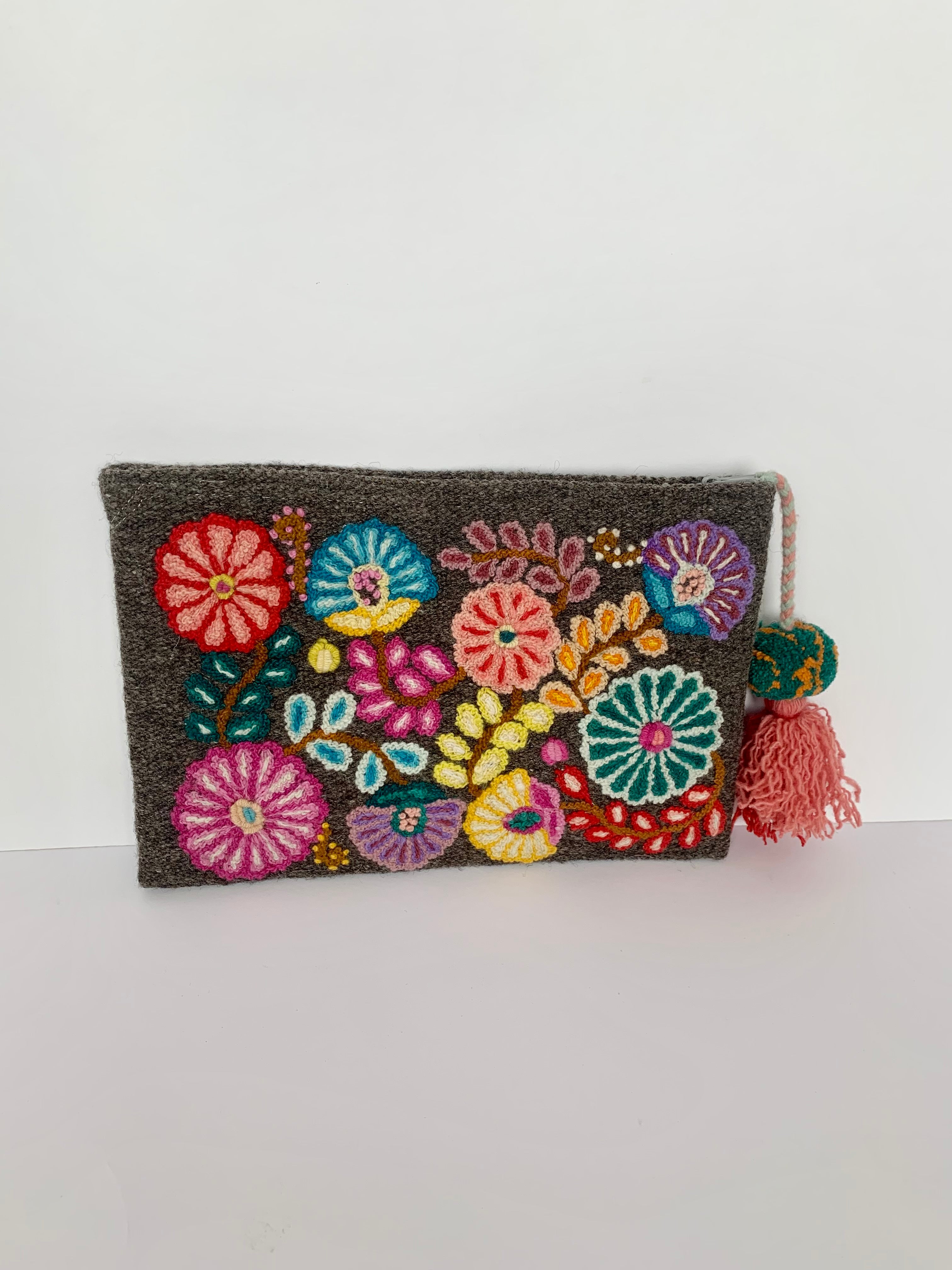 Bright Embroidered Clutch with floral design, tassel zipper, and gray cotton lining. 