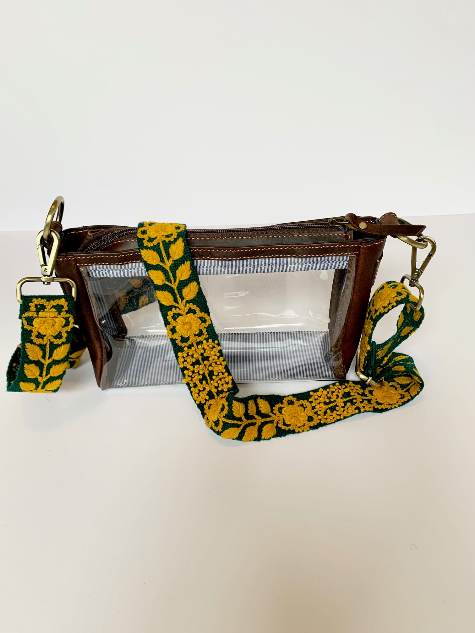 Alison Adjustable Purse Strap, green and gold floral and leaf design attached to a fair trade clear bag 