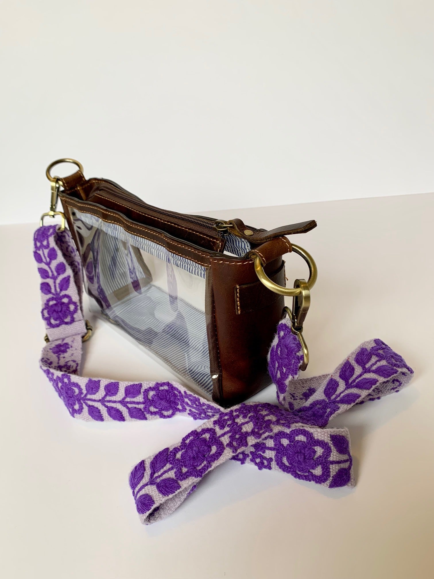 Eliza Adjustable Purse Strap featuring a floral design shown with the Claire Fair Trade Clear Purse.